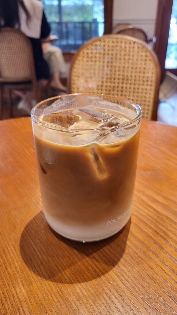 Café latte at minimalist coffee shop near Samseong Station