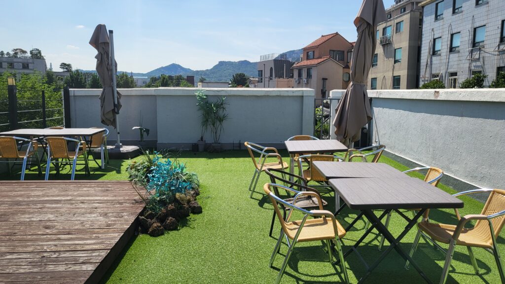 Rooftop area spacious seating at Hollow Café Anguk Station in Seoul