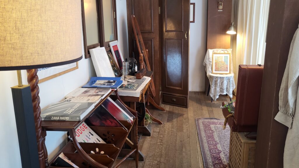 Cozy vintage interior with books and paintings
