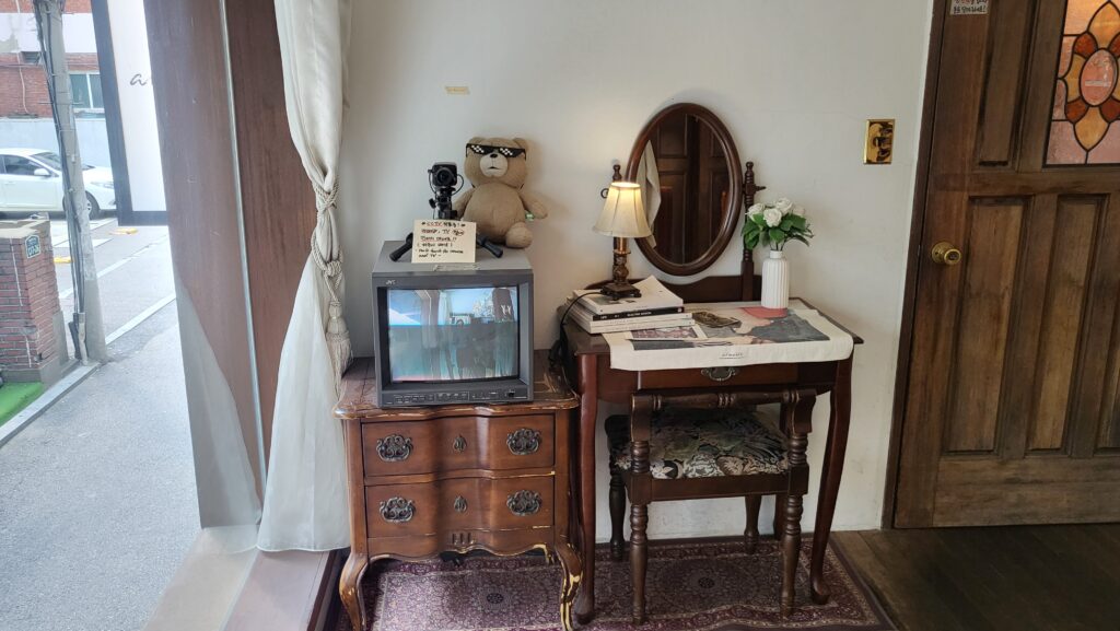 Cozy vintage interior with books and paintings
