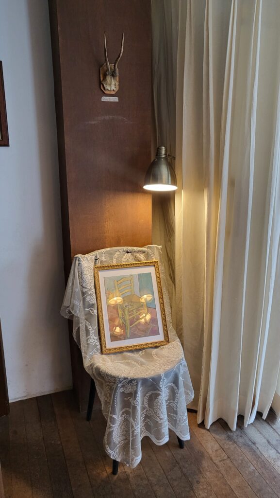 Cozy vintage interior with books and paintings
