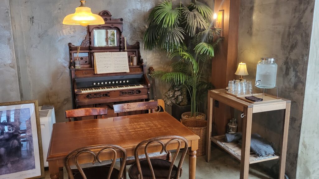 Cozy seating on the second floor of European cafe near me Cafe Armoire