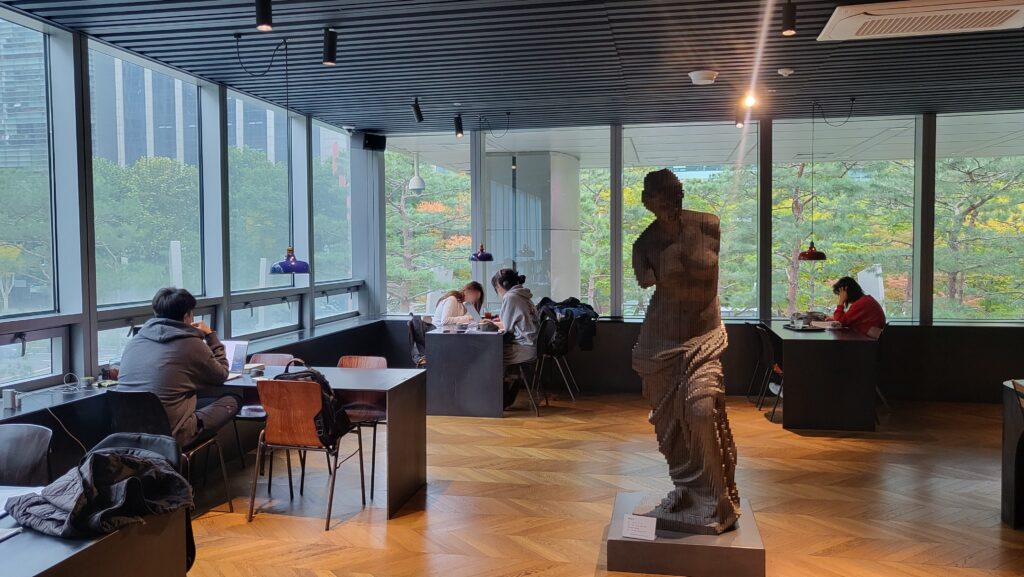 Window seat at Terarosa POSCO Book Cafe with power outlet for laptop